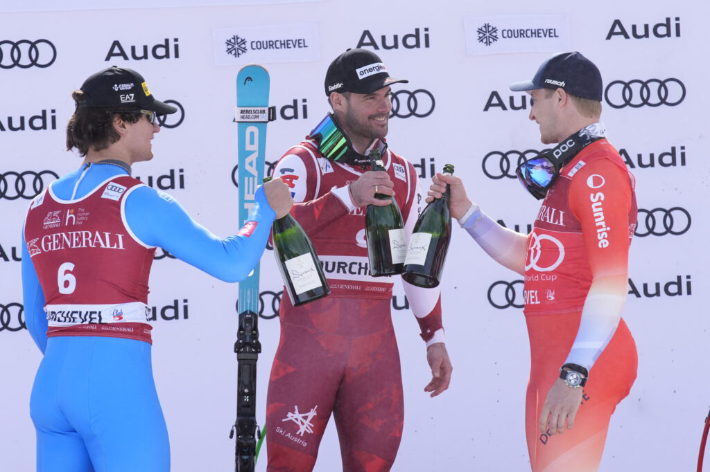 Ultima discesa maschile a Courchevel, 13-03-2026. Il podio. Da sinistra: Franzoni, Kriechmayr, Odermatt ©Pentaphoto